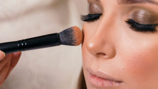 Lady having blusher applied to her face