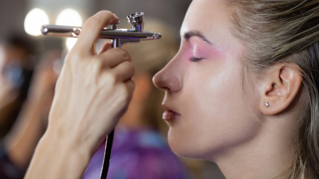 Pink Make up being applied to the eyes