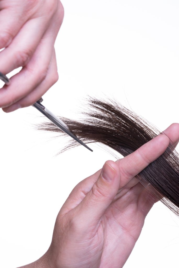 Cutting hair extensions on our hair extension course